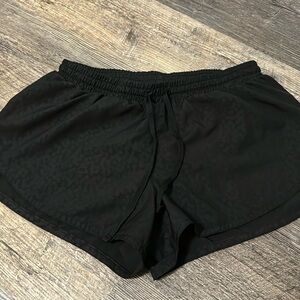 Old navy black with pattern running shorts with strings to adjust waist.